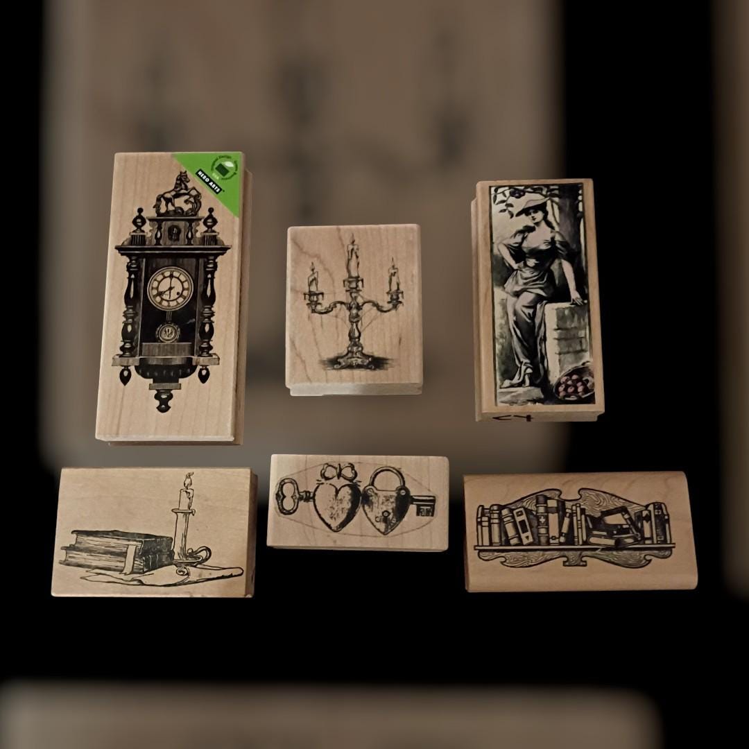 Lot of 6  wood mounted rubber stamps – clock, books, candelabra, keys,...