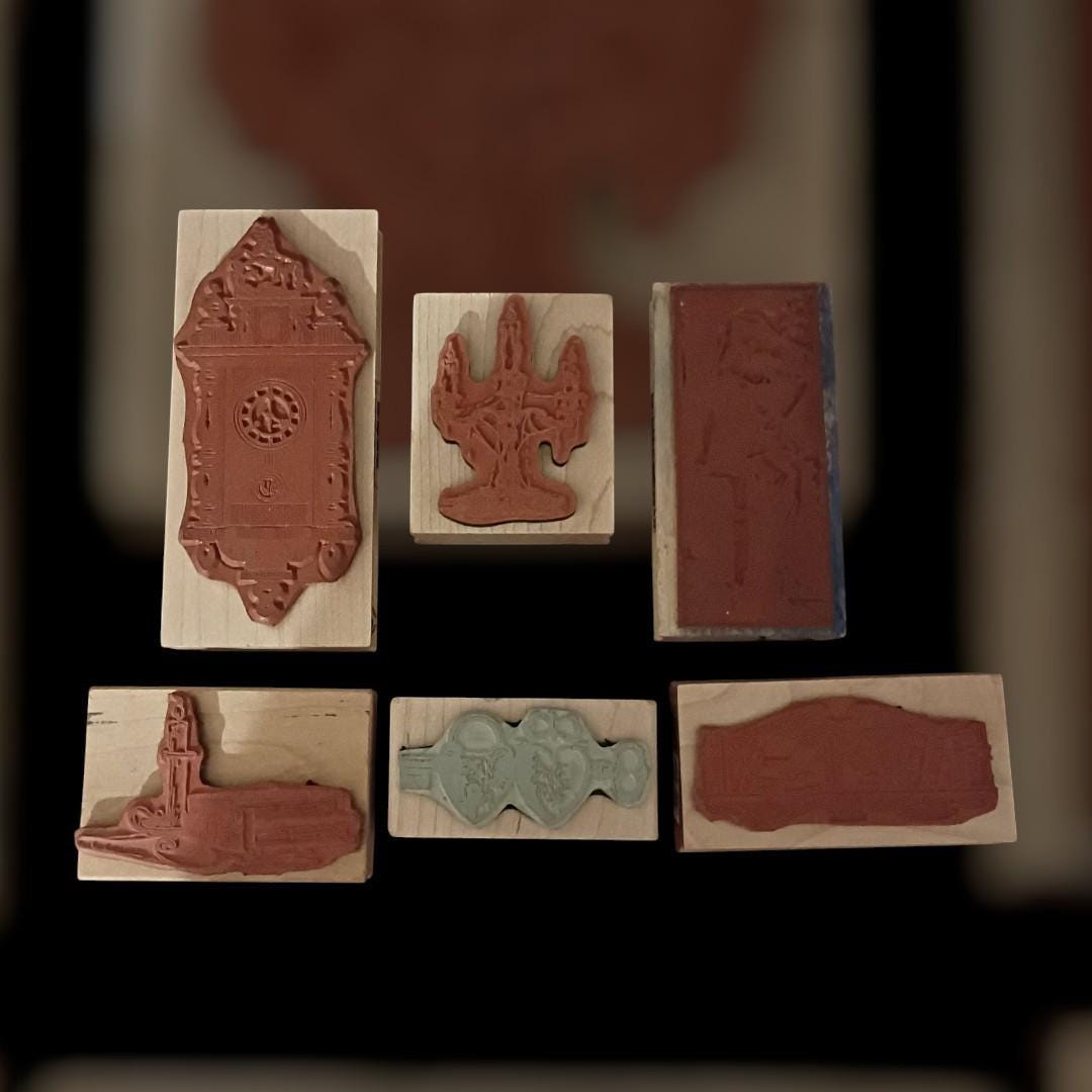 Lot of 6  wood mounted rubber stamps – clock, books, candelabra, keys,...