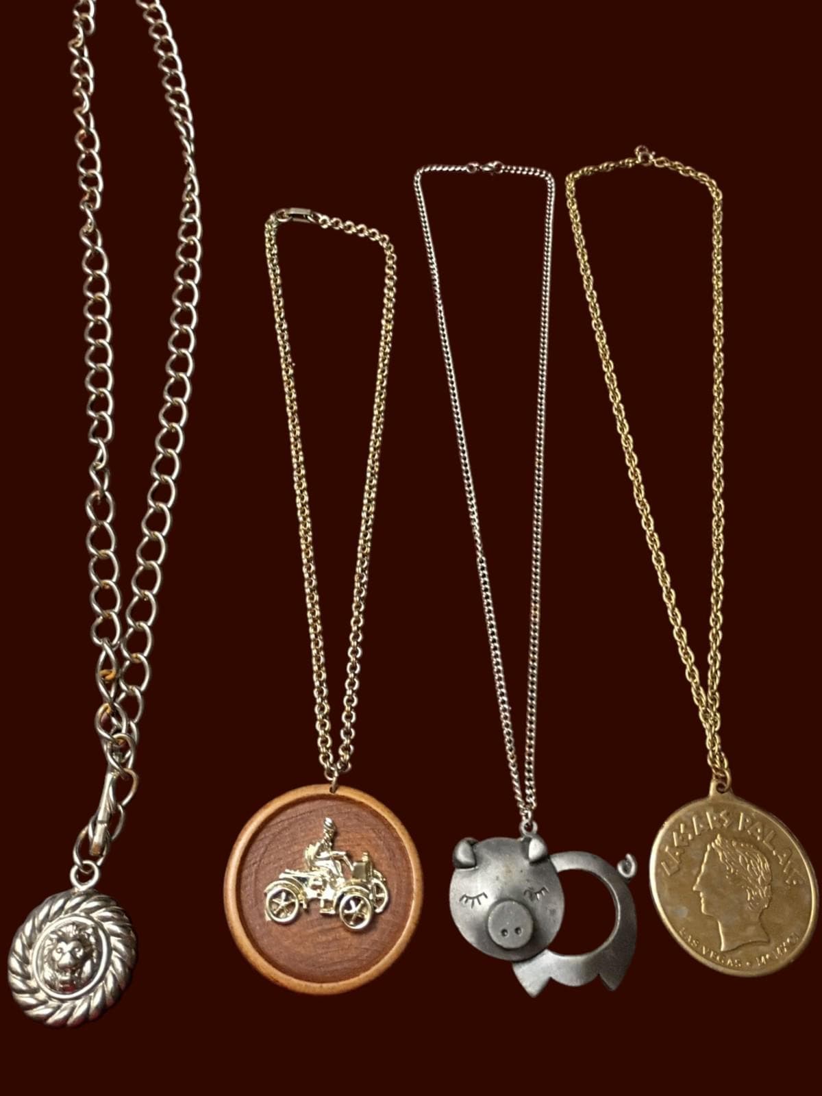 Necklace lot 4 unique pendants lion medallion, antique car, pig caesars pal...