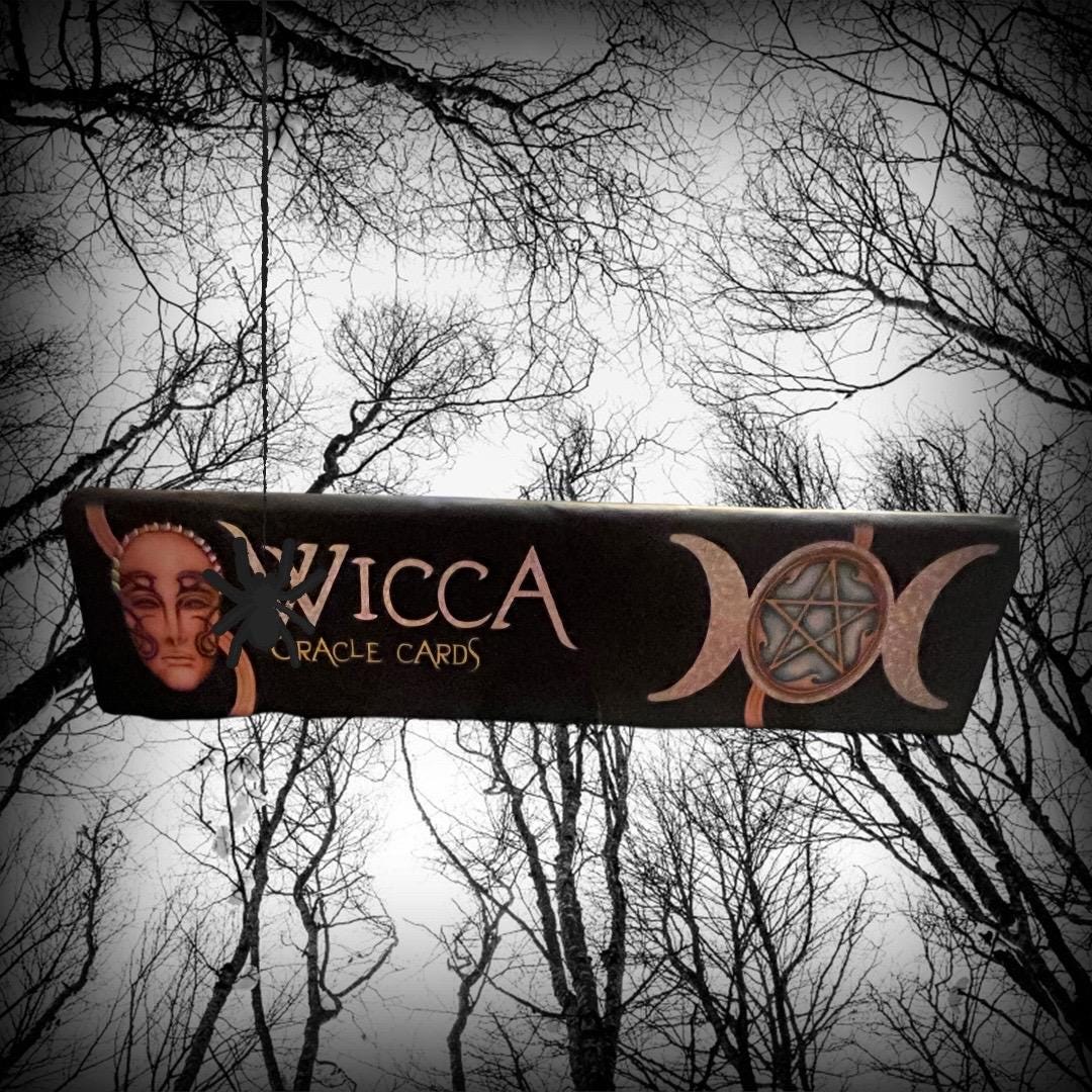 These images show the Wicca Oracle Cards (New Edition) by Nada Mesar and Lunaea Wheaterstone, with artwork by Chatriya Hemharnvibul — publis