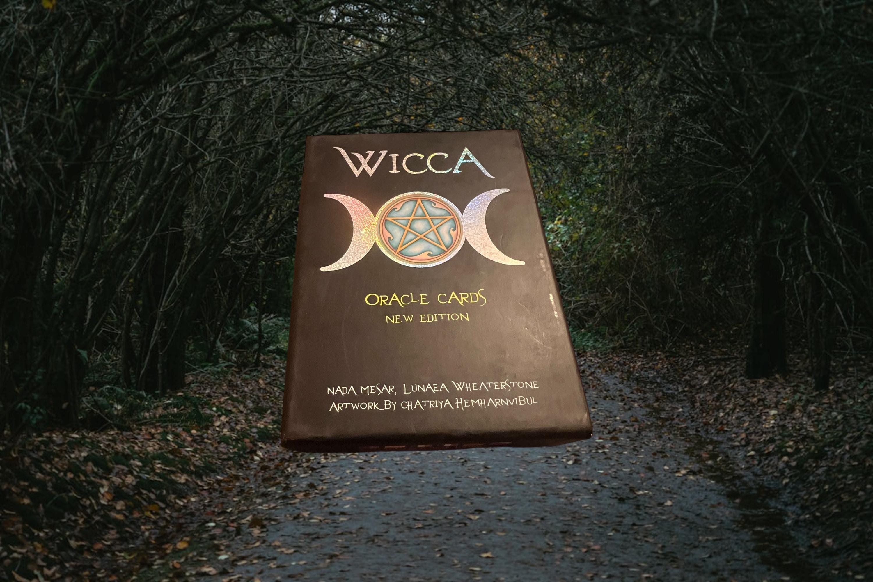 These images show the Wicca Oracle Cards (New Edition) by Nada Mesar and Lunaea Wheaterstone, with artwork by Chatriya Hemharnvibul — publis